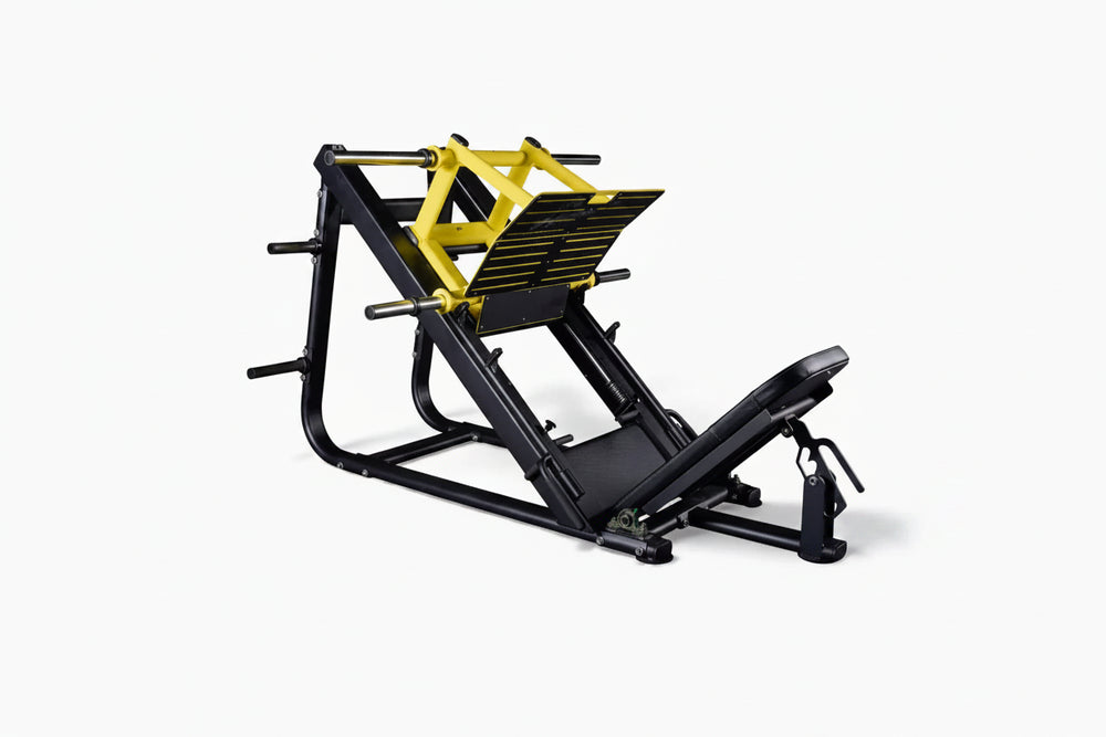 Black and yellow leg press machine on a white background