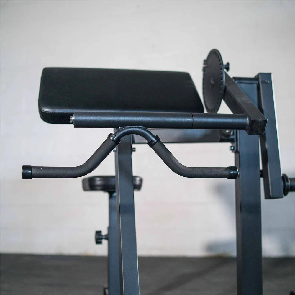 Black preacher curl gym machine with adjustable backrest and arm support on a gray background