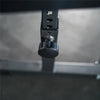 Close-up of pin adjustment on a preacher curl gym machine on a metallic surface