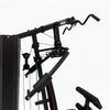 Black gym machine with pulleys on a white background