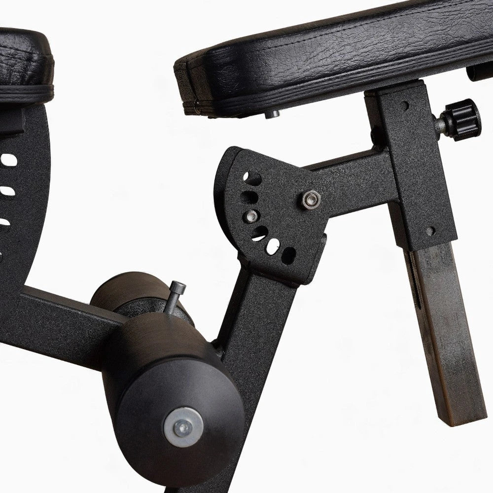 Adjustable seat on leg extension and curl machine on a white background