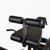 Padded seat of commercial Leg Extension and Curl Machine on a white background