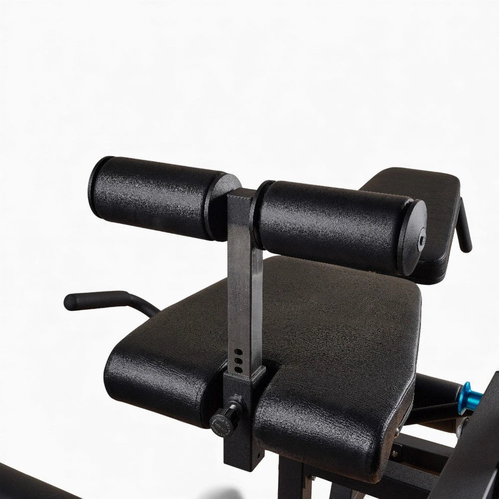 Padded seat of commercial Leg Extension and Curl Machine on a white background