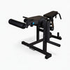 Black frame curl machine with leg extension on a white background
