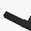 Close up of a sturdy black steel metal leg of a leg extension curl machine on a white background