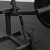 Safety stop lever and resting cradle of a plate loaded seated calf raise machine