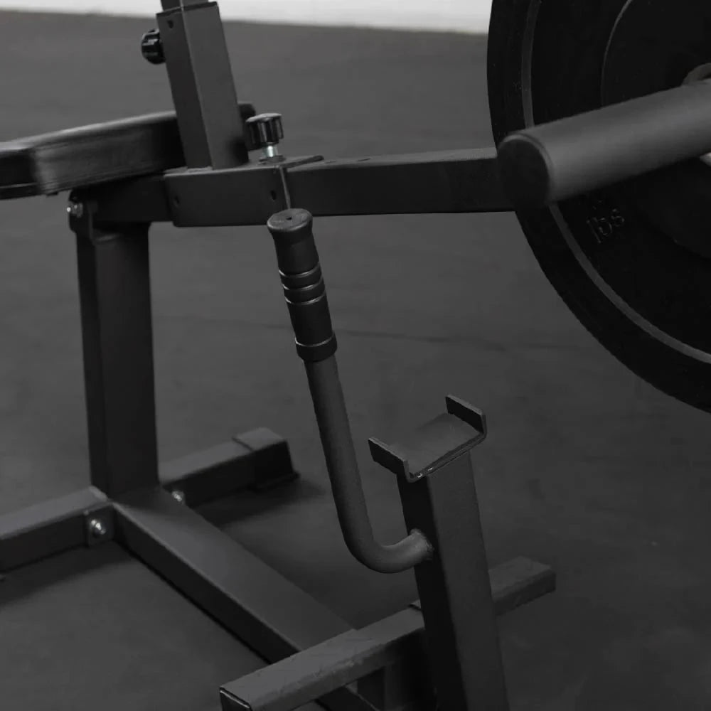 Safety stop lever and resting cradle of a plate loaded seated calf raise machine