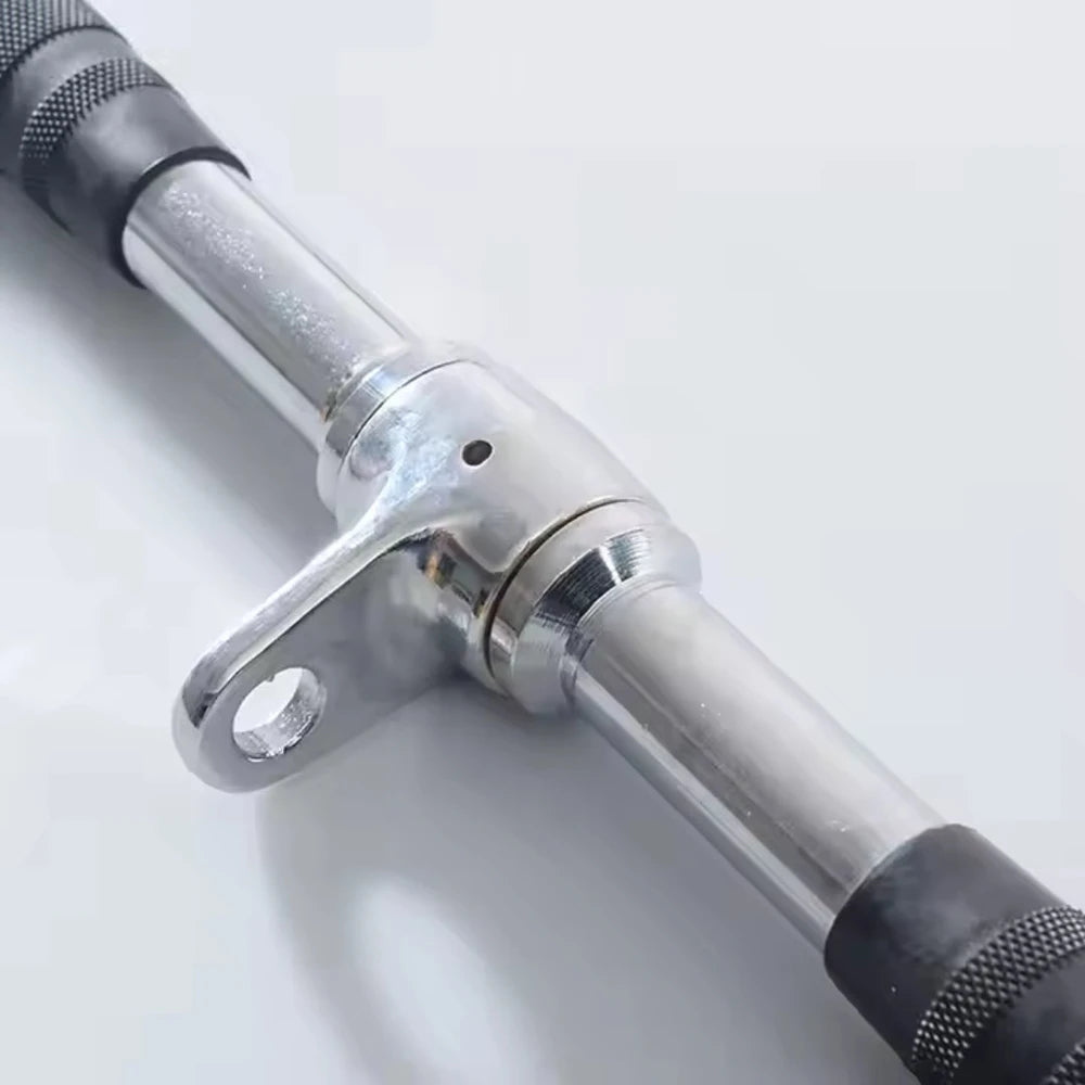 Close up of steel bar cable attachment and black rubber grip handles