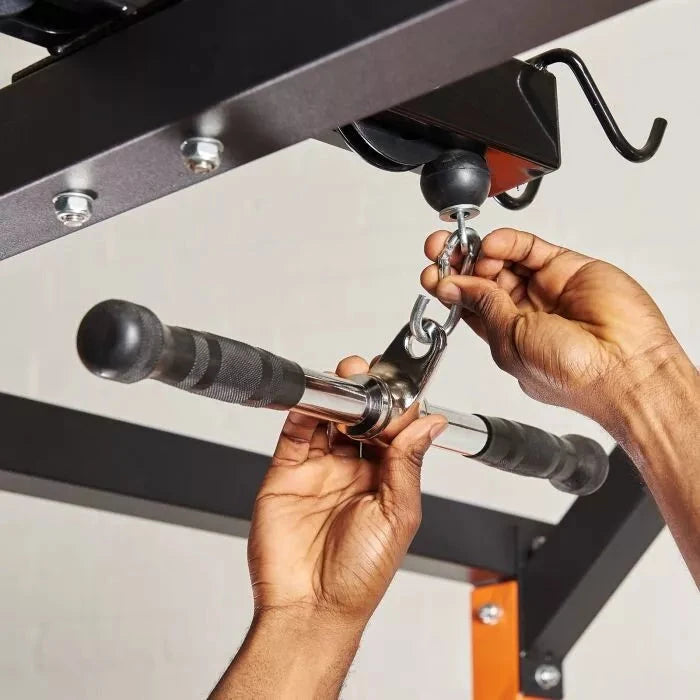 Image showing the easy clip removal of a straight bar cable machine attachment