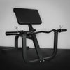 Black gym machine on a dark surface with a gray background