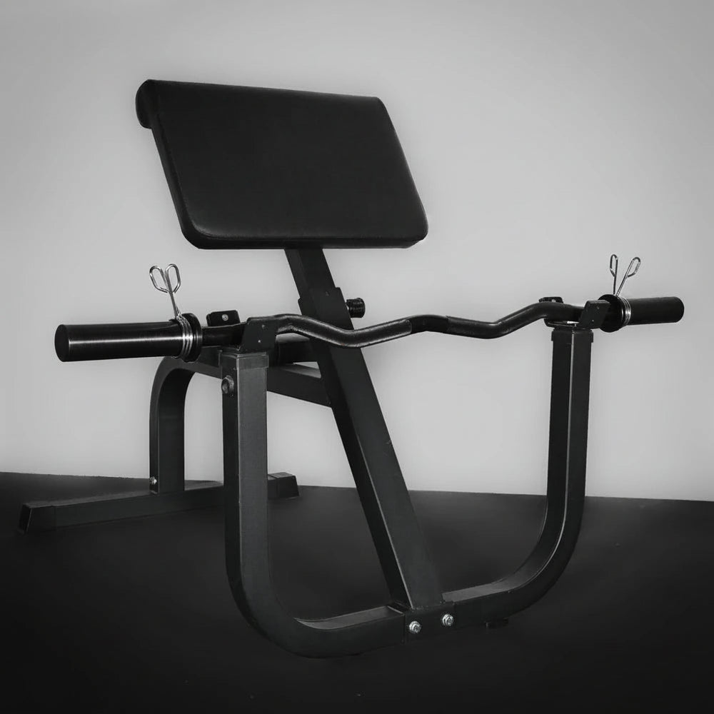 Black gym machine on a dark surface with a gray background