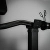 Barbell in holder on a preacher curl bench