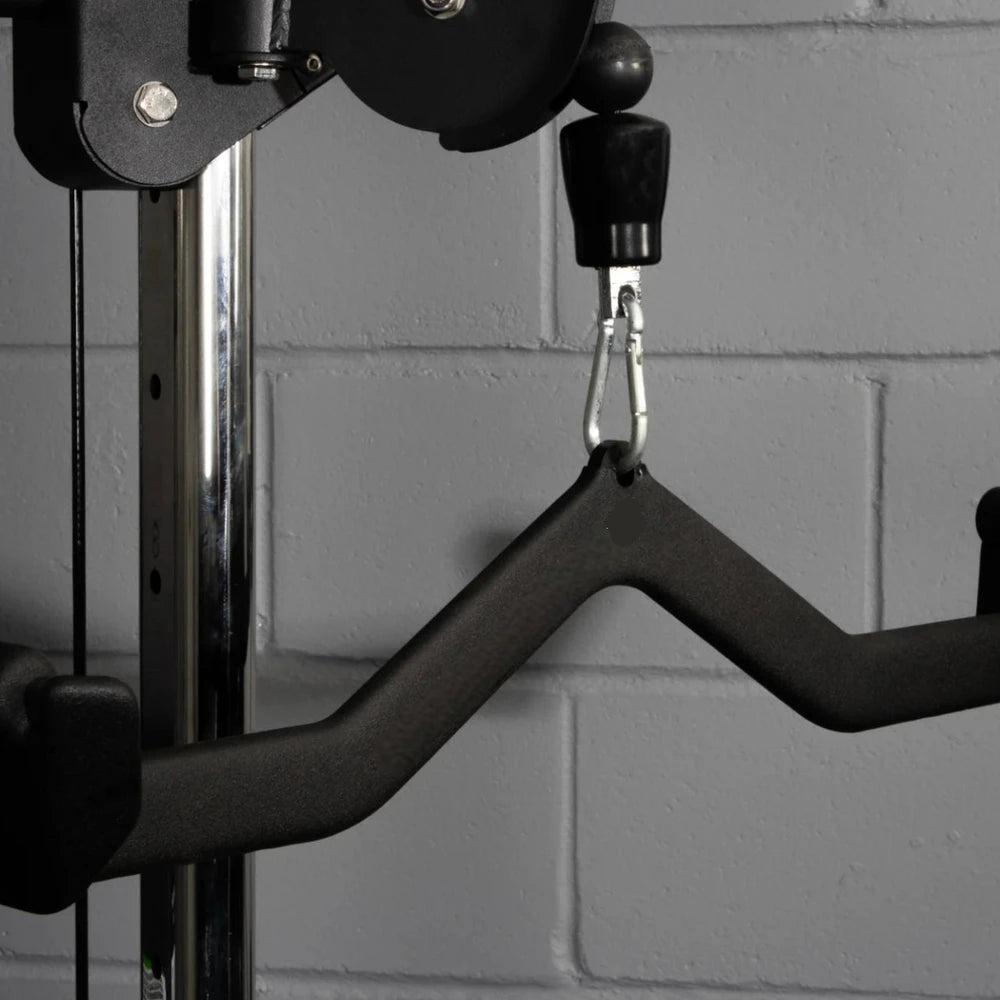 Gym cable attachment attached to gym machine on a grey brick background