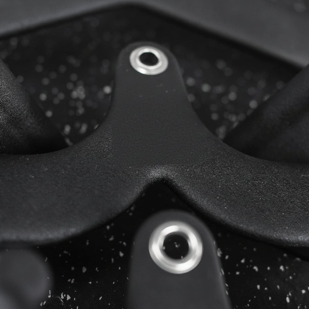 Close up of attachments for gym cable on a dark background