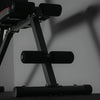 Close up of footrest of gym bench with a dark background