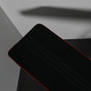 Black back cushion of gym bench on black textured floor
