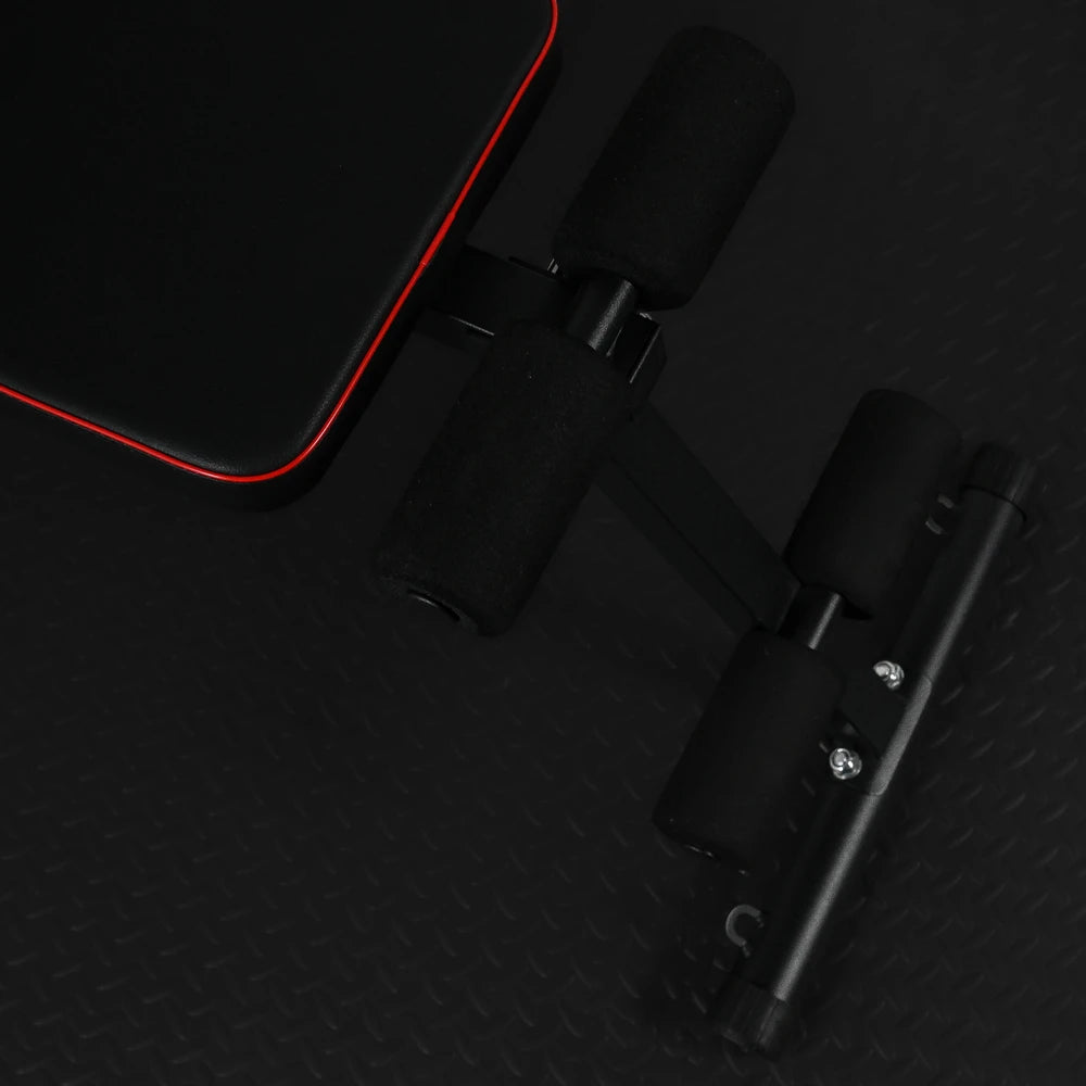 Close up of comfort footrests on a black gym bench