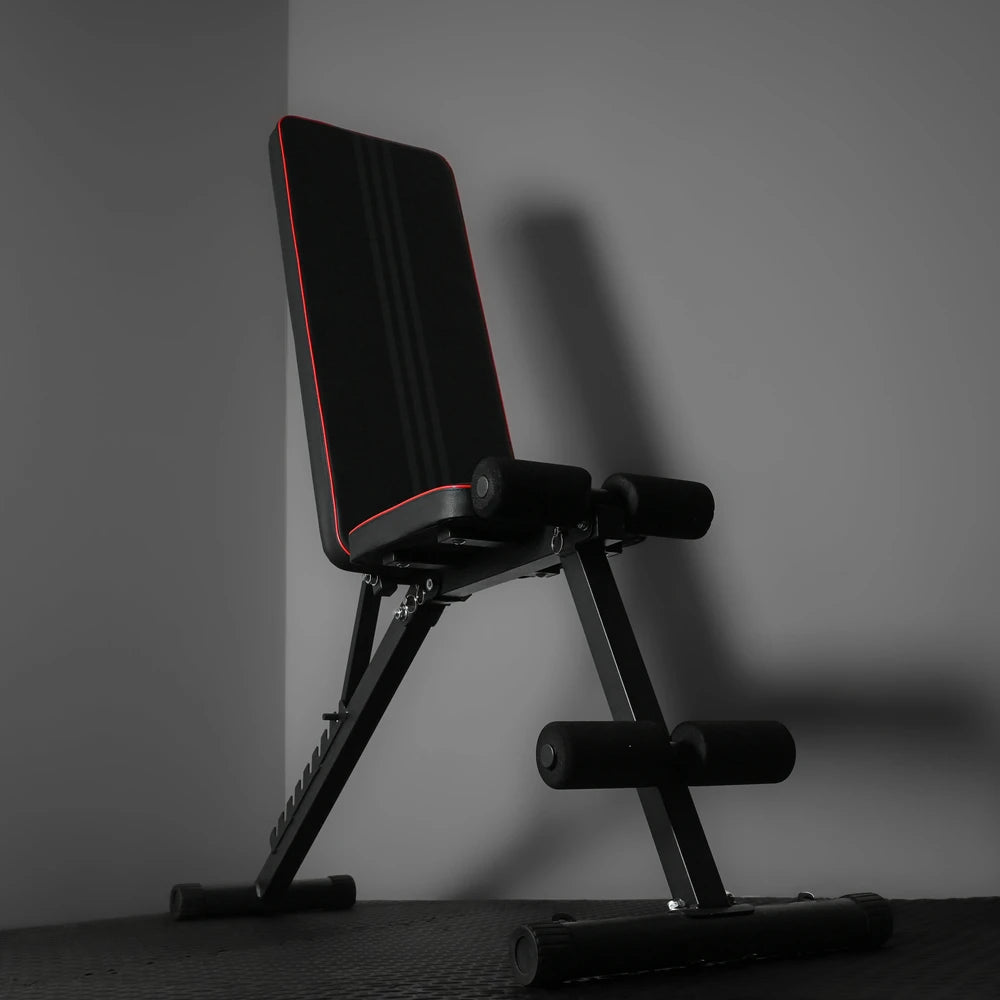 Gym bench with red piping on a black floor and grey background