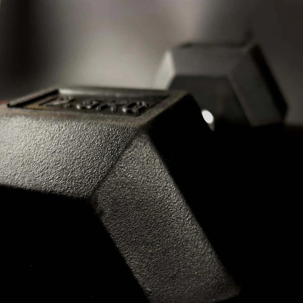 Close up of a hex dumbbells with dark background