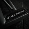 Close-up of a gym equipment component with 'GYM SUPERSTORE' branding.