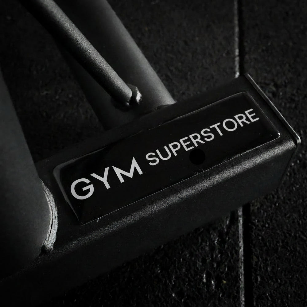 Close-up of a gym equipment component with 'GYM SUPERSTORE' branding.