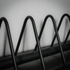 Close up of black weight plate storage rack
