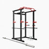 Black and red power rack with barbell and weight plates on a white background