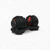 Black adjustable gym weights with stand on a white background