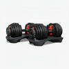 Set of black adjustable dumbbells on a white background