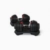Pair of adjustable dumbbells on dumbbell stands with a white background