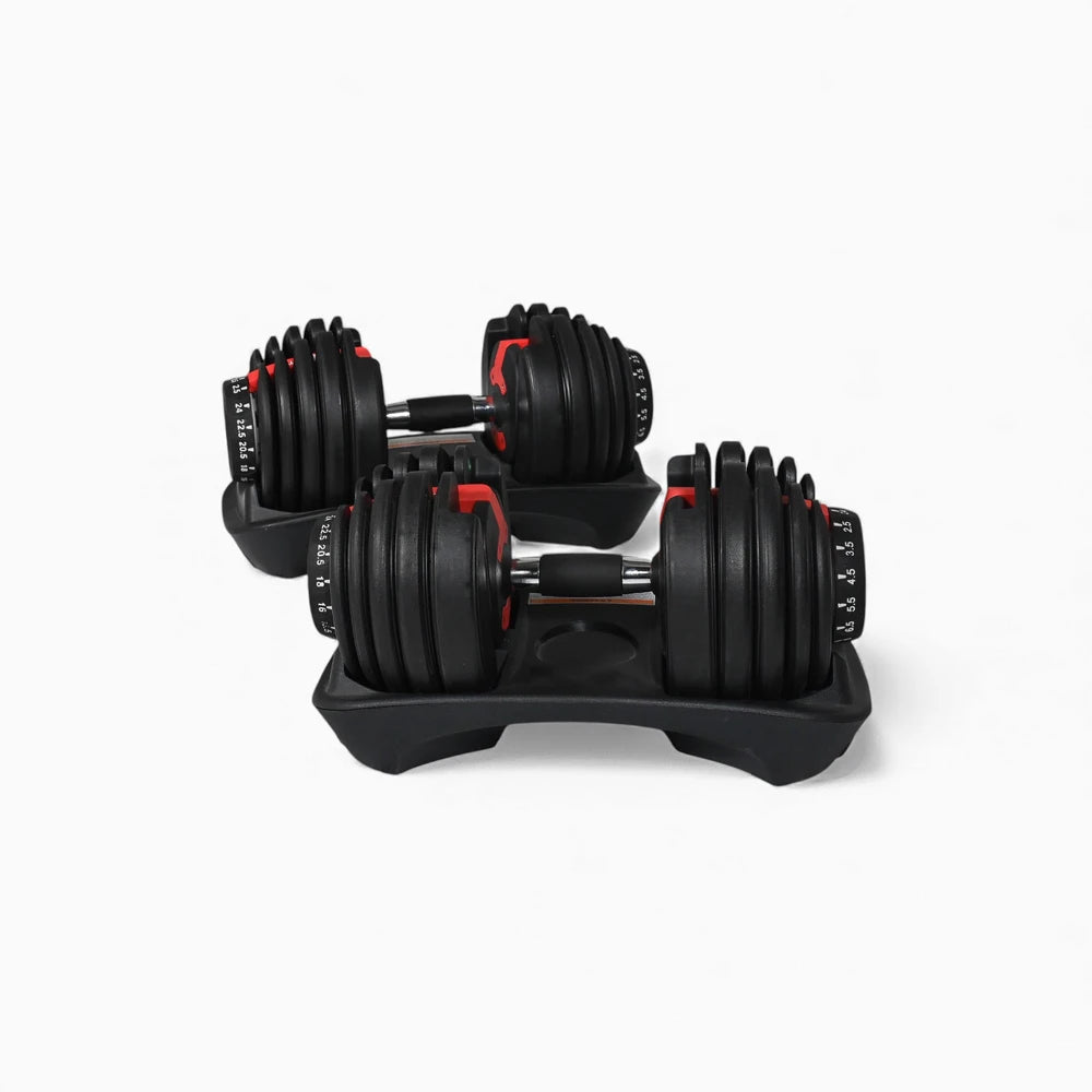 Pair of adjustable dumbbells on dumbbell stands with a white background