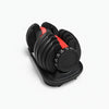 Adjustable dumbbell with weight increment markings on a white background