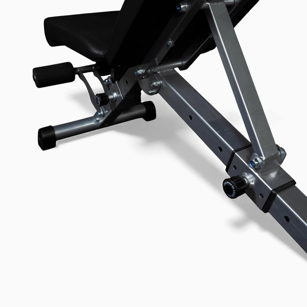 Black weight bench on a white background