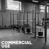 Commercial gym equipment on a black tiled gym floor