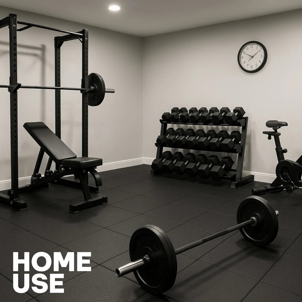 Home gym with gym machines and heavy weights on a heavy duty tiled floor