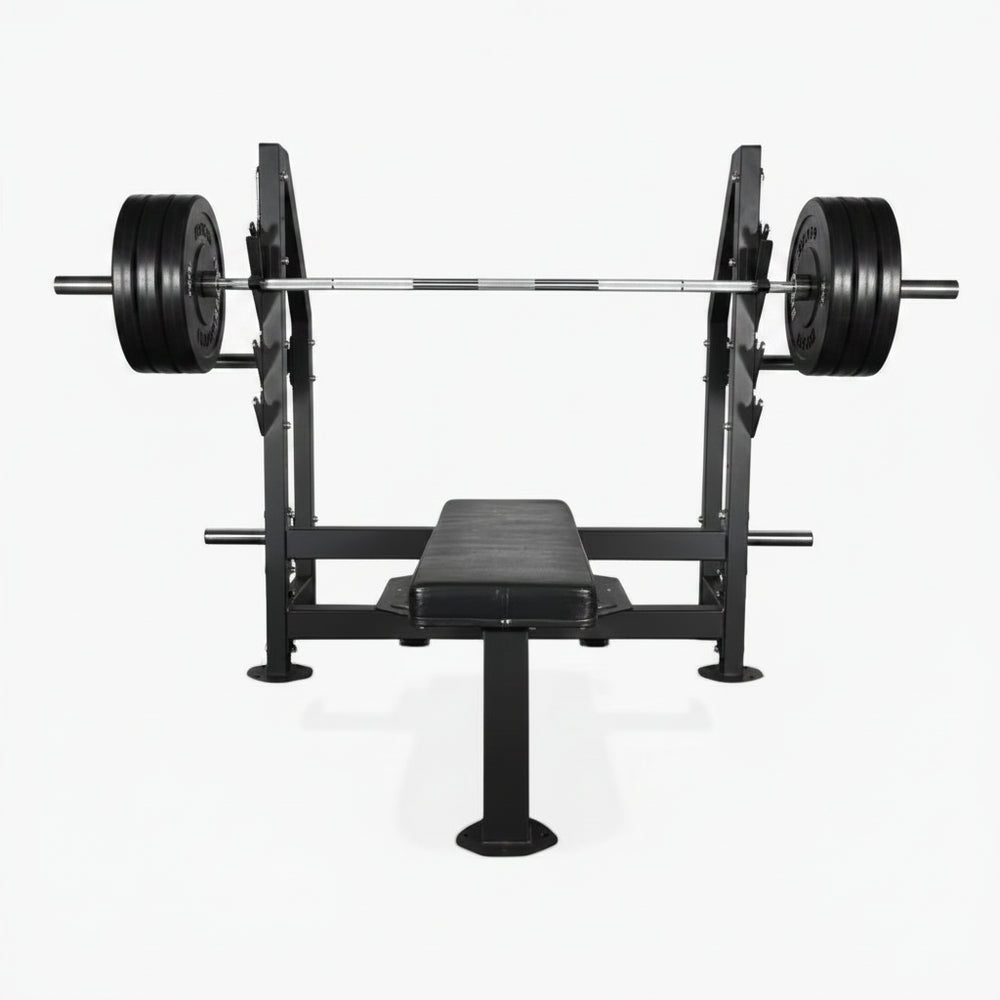 Black gym bench in flat position with barbell and weights above on a white background