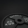 25kg barbell weight plate on a black background