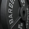 Close up of embossed writing on a black barbell weight