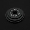 Set of 3 black barbell weight plates on a black background