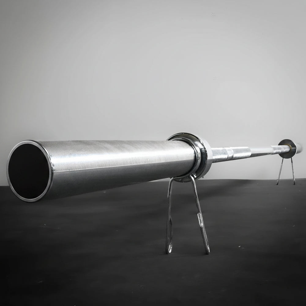 Barbell with weight plates on a gray background
