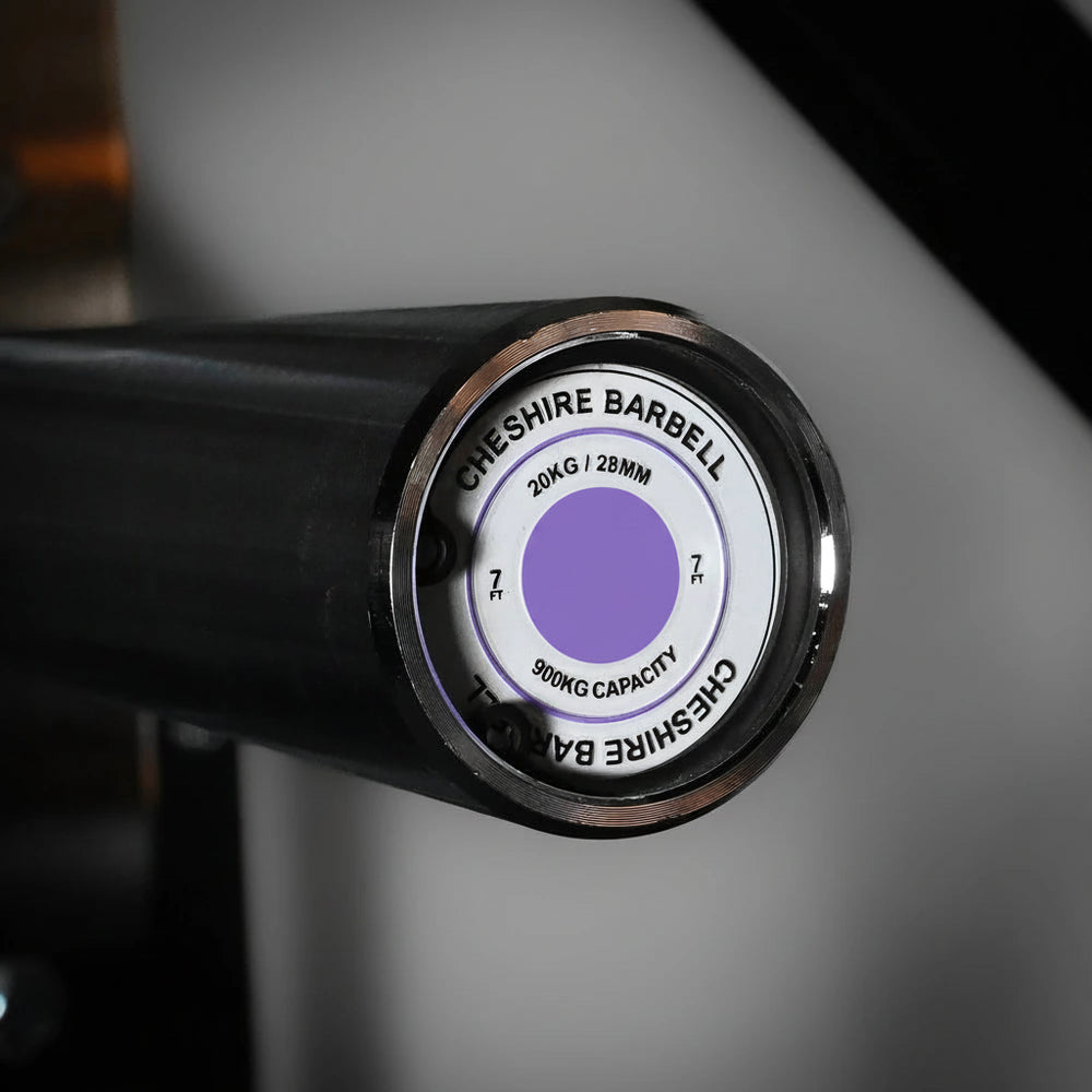 Close-up of a Cheshire Barbell weight plate on a blurred background