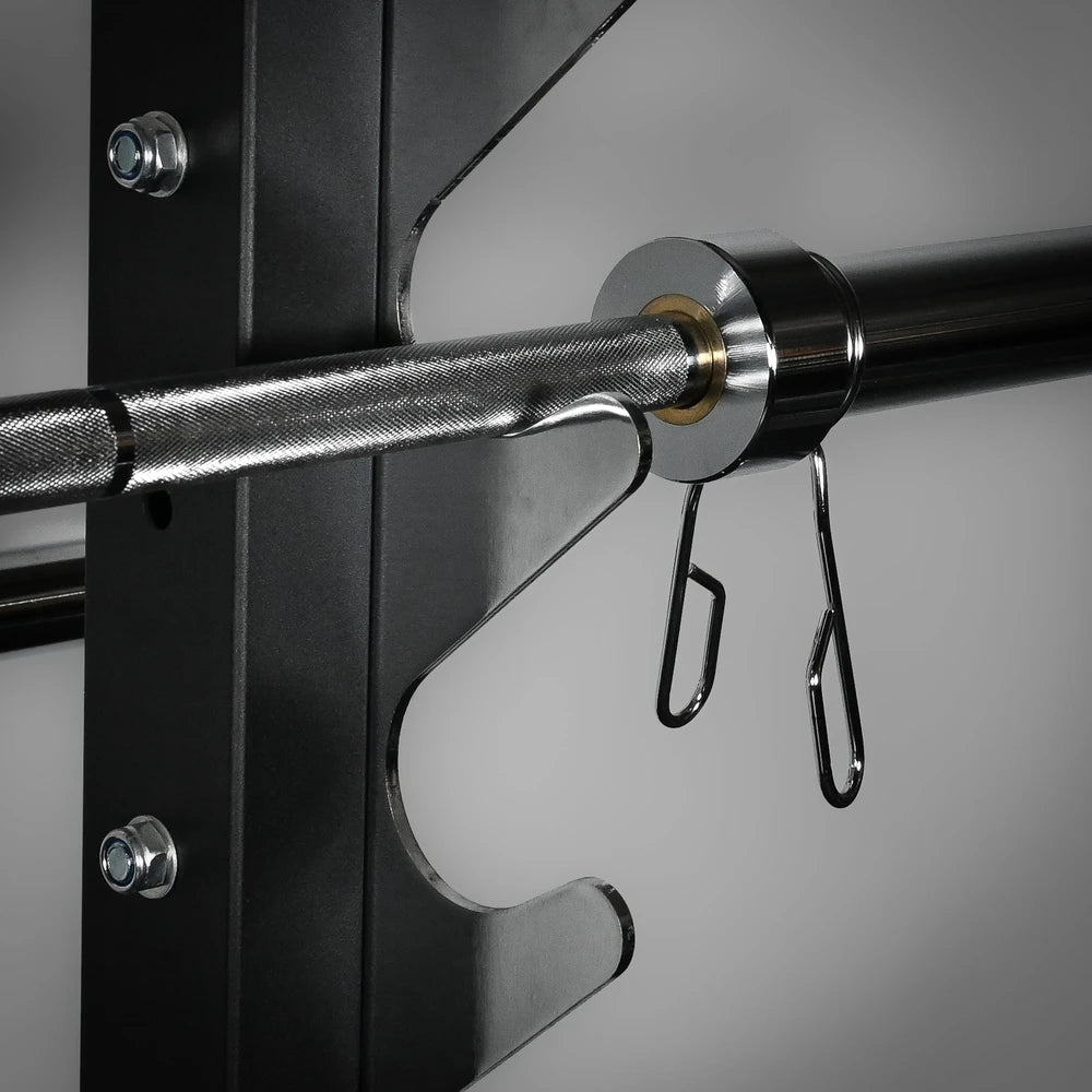 Metal barbell with hooks attached to a black metal frame on a gray background