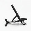 Black weight bench on a white background