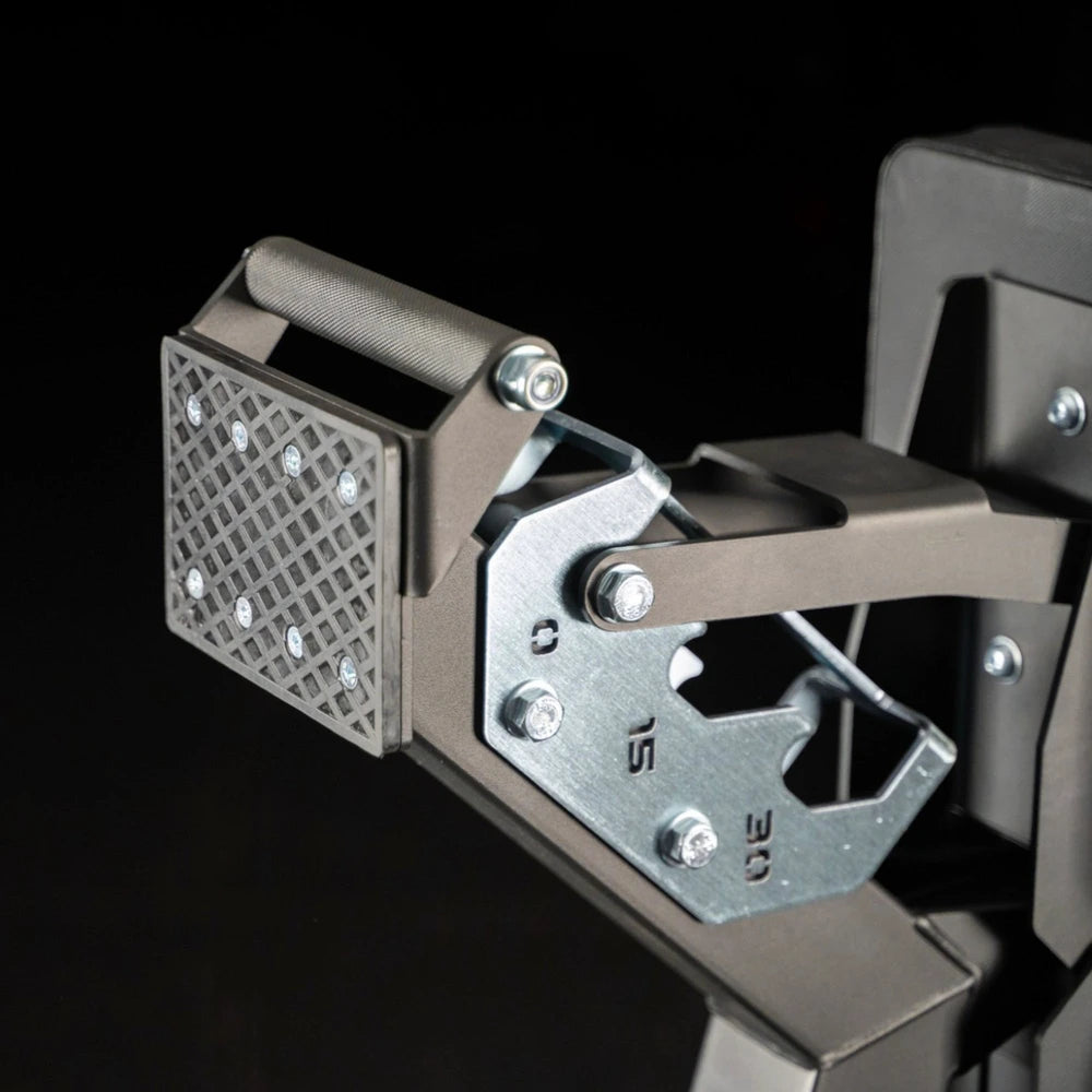 Close-up of a metallic mechanical device with visible branding on a black background