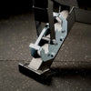 Close-up of a mechanical device with gears on a dark textured surface