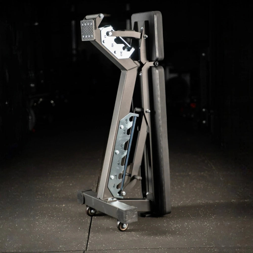 Folded gym bench on a dark background