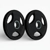Two black weight plates with '5 KG' marking on a white background
