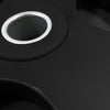 Close-up of a black weight on a dark background