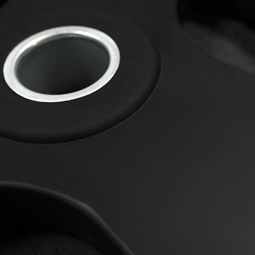 Close-up of a black weight on a dark background