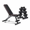 Black adjustable weight bench with dumbbells on a white background